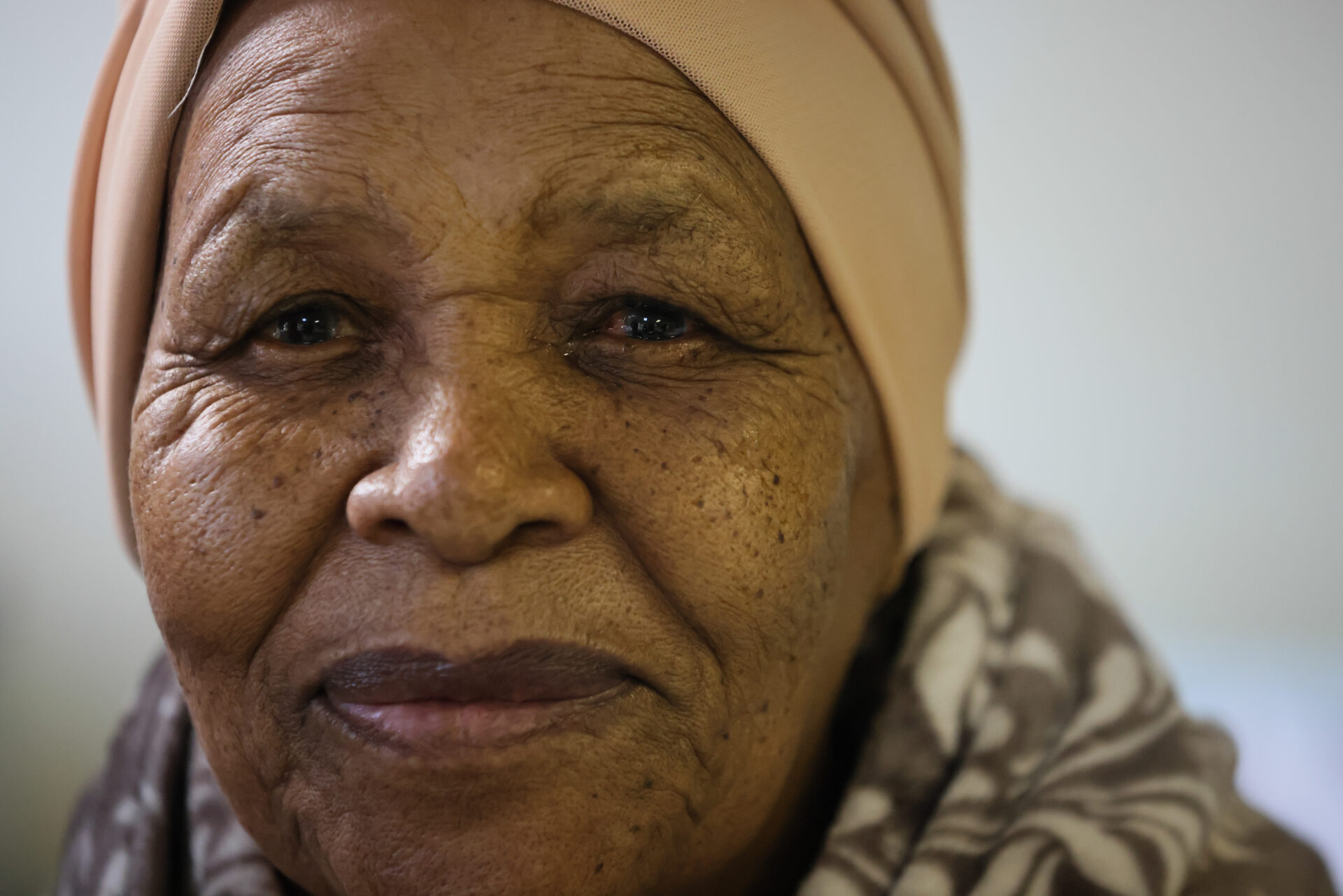 A close up of a woman (Rhoda Duduzile Phakati) smiling at the camera.