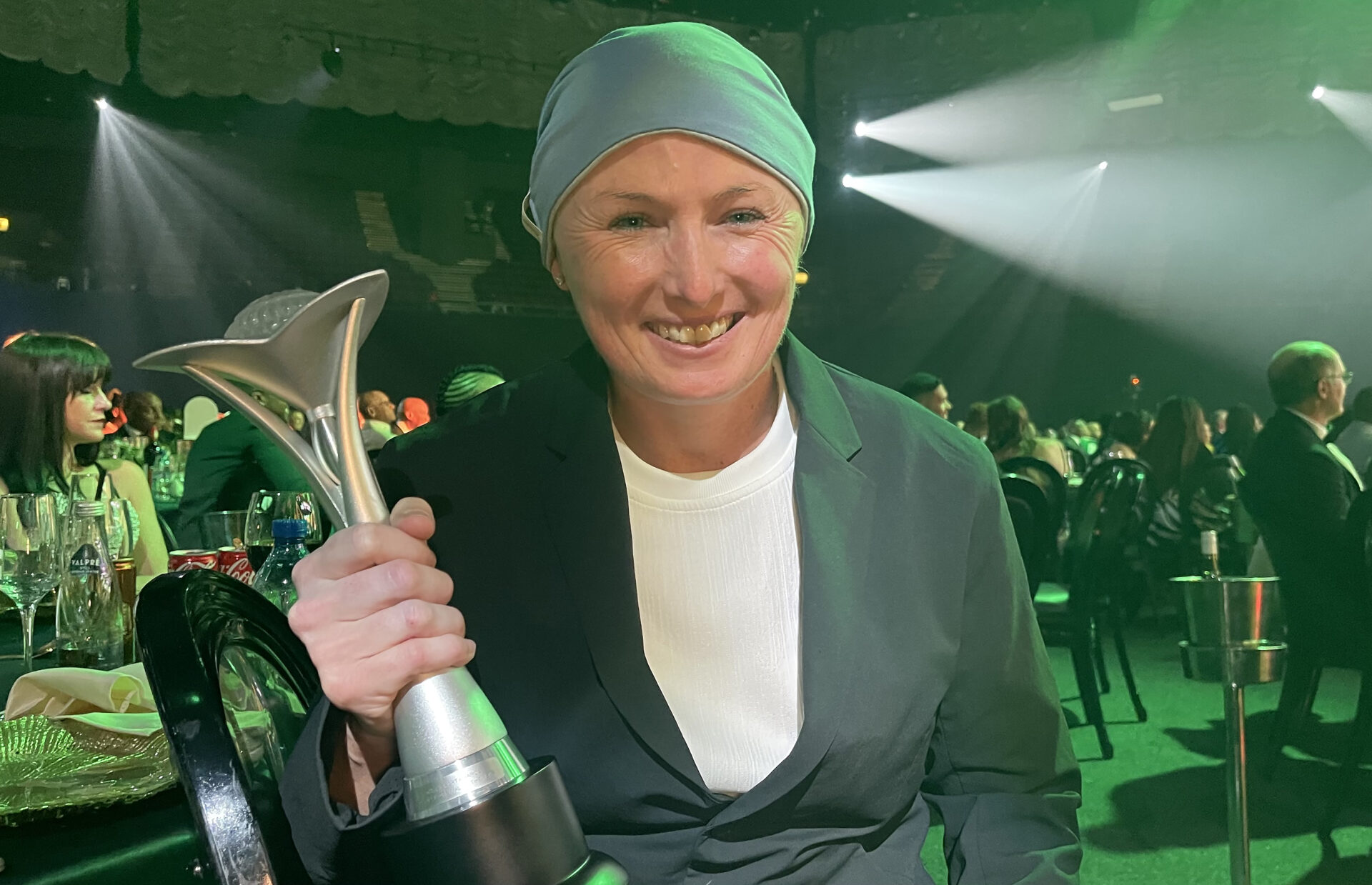 A smiling Aimee Barrett-Theron holds her trophy that she won for being named Technical Official of the Year during the 19th Annual South African Sport Awards.